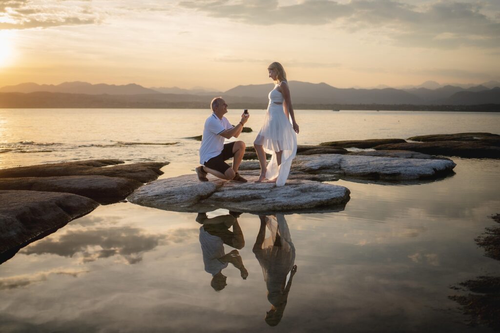 Marriage proposal on shore line